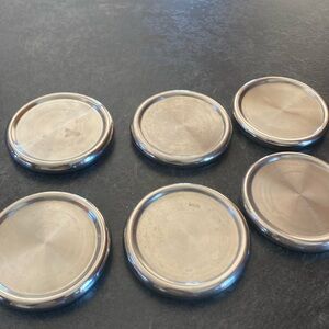 Set of 6 metal coasters.